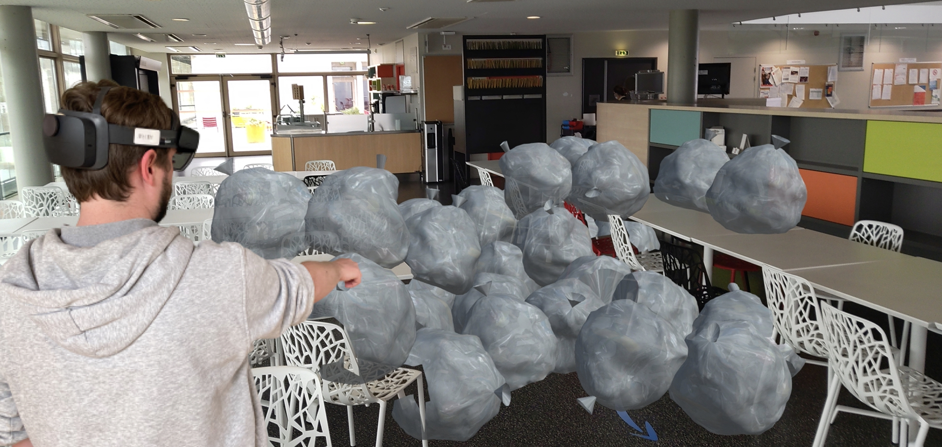 An employee views the amount of waste generated by their cafeteria over a week using AR